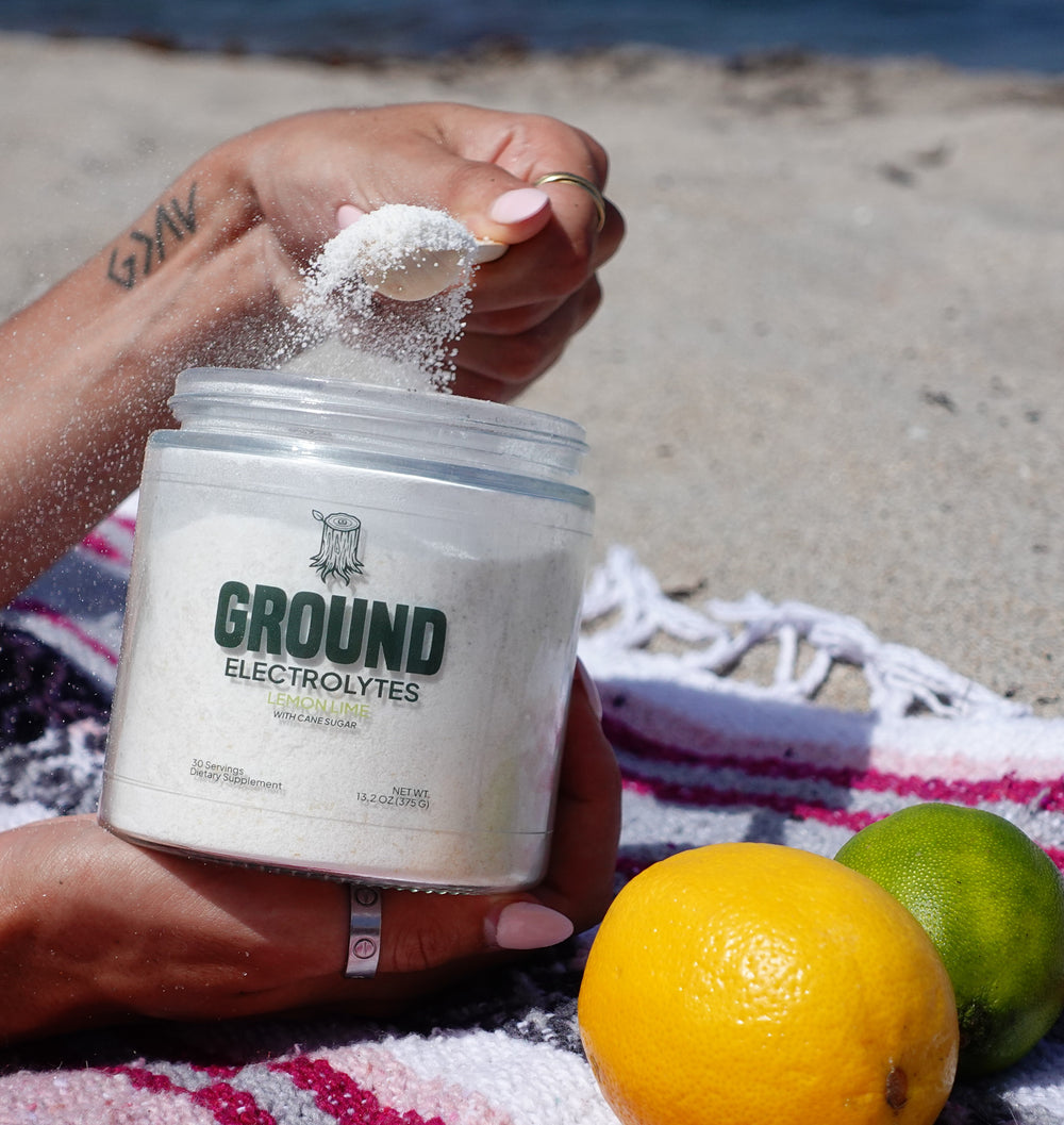 model on beach scooping from ground electrolytes jar