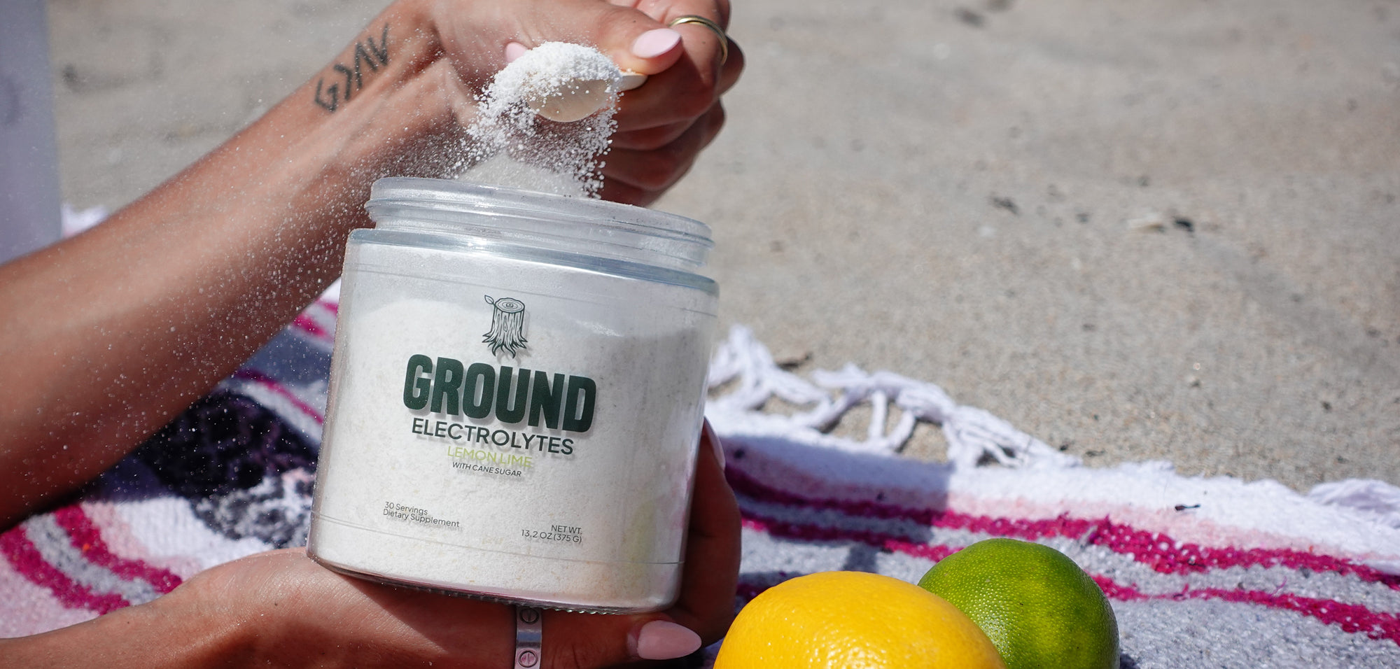 model on beach scooping from ground electrolytes jar