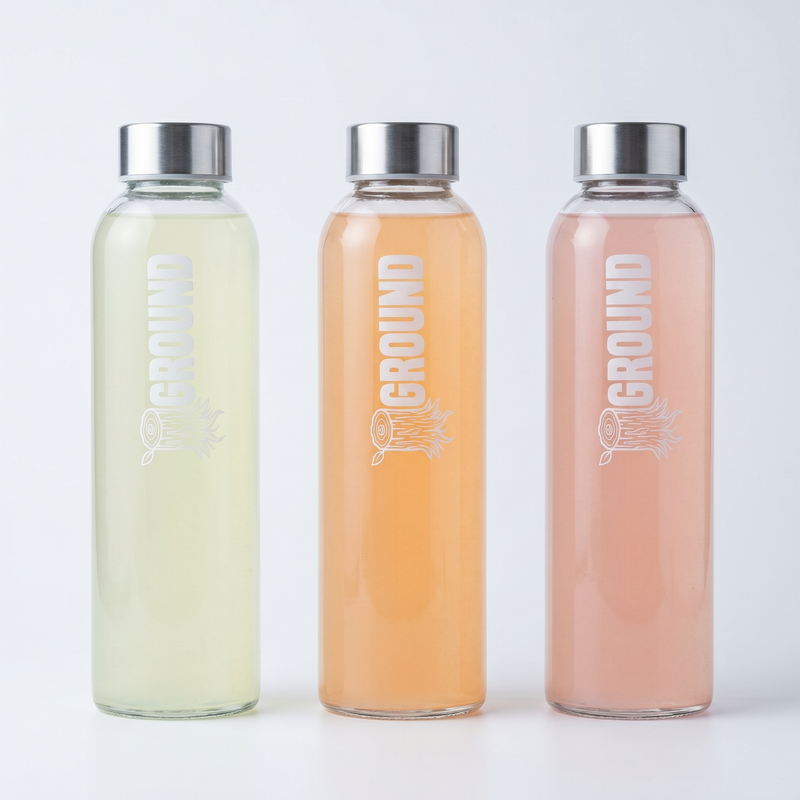 three glass bottles of ground electrolytes citrus flavors